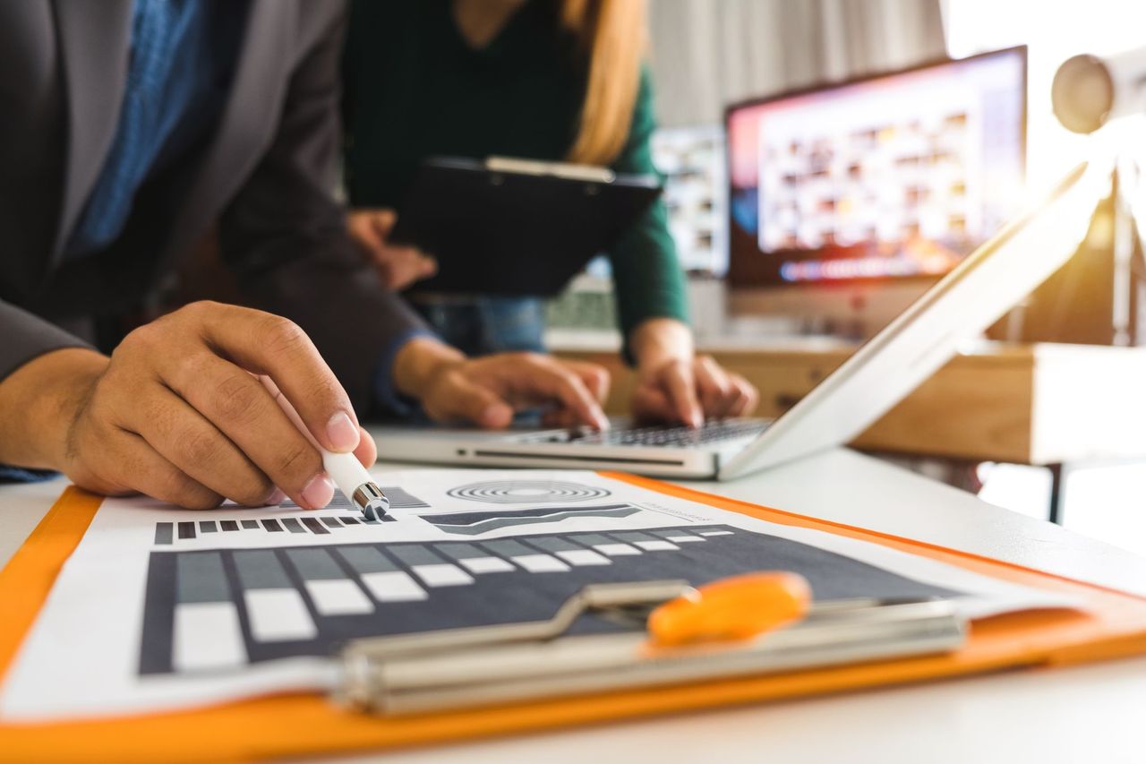 coronis health stock image of coworkers working on a page about medical billing for outpatient procedure centers