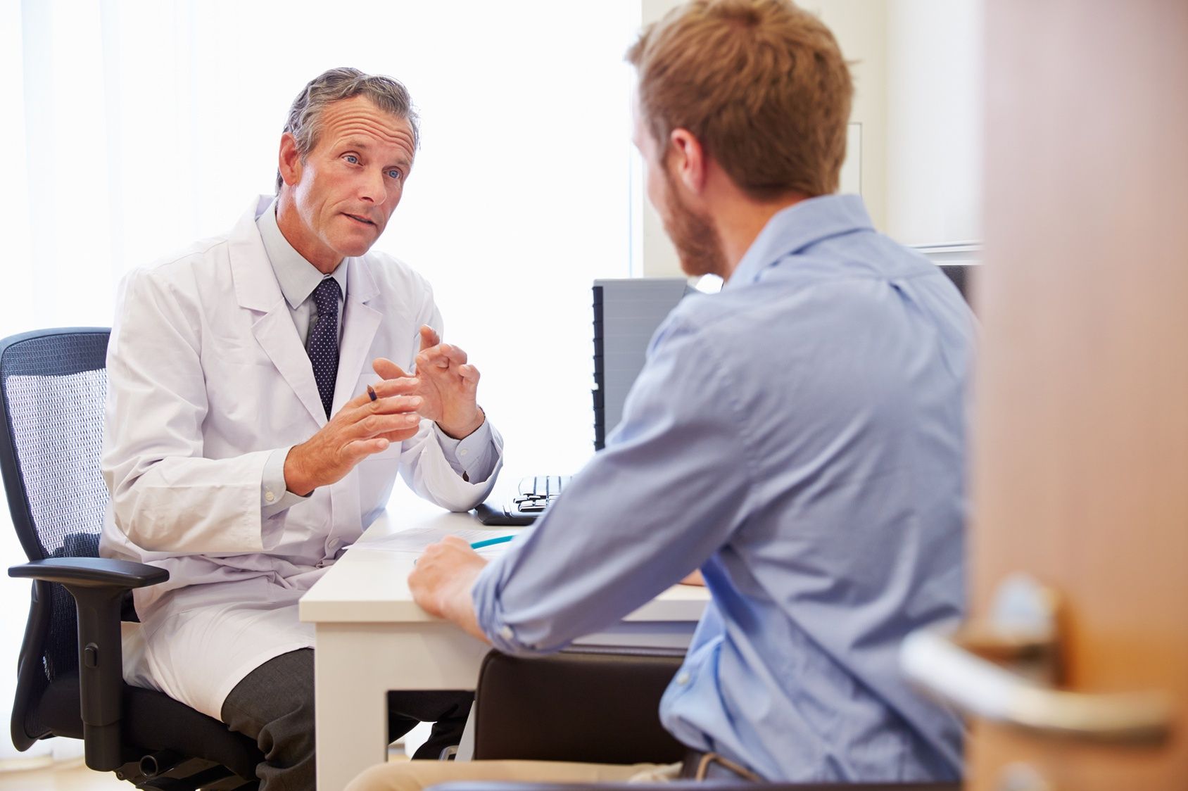 substance abuse treatment center doctor talking with a patient