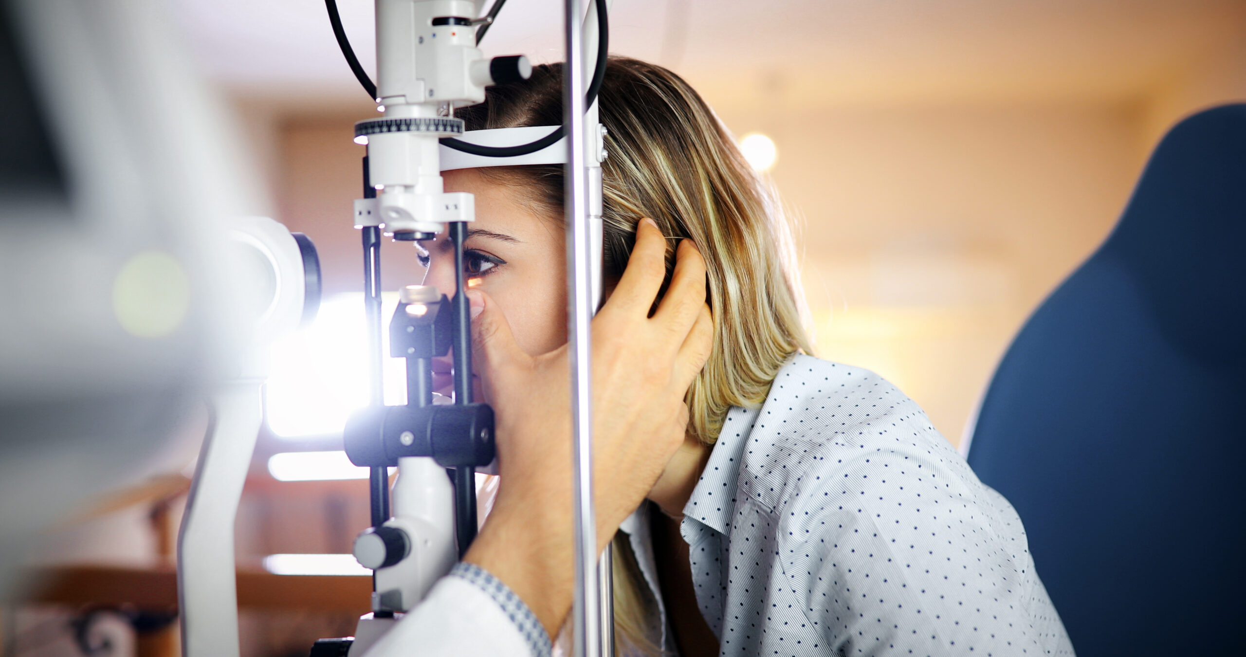 Coronis Health patient getting an eye exam Ophthalmology Medical Billing Services