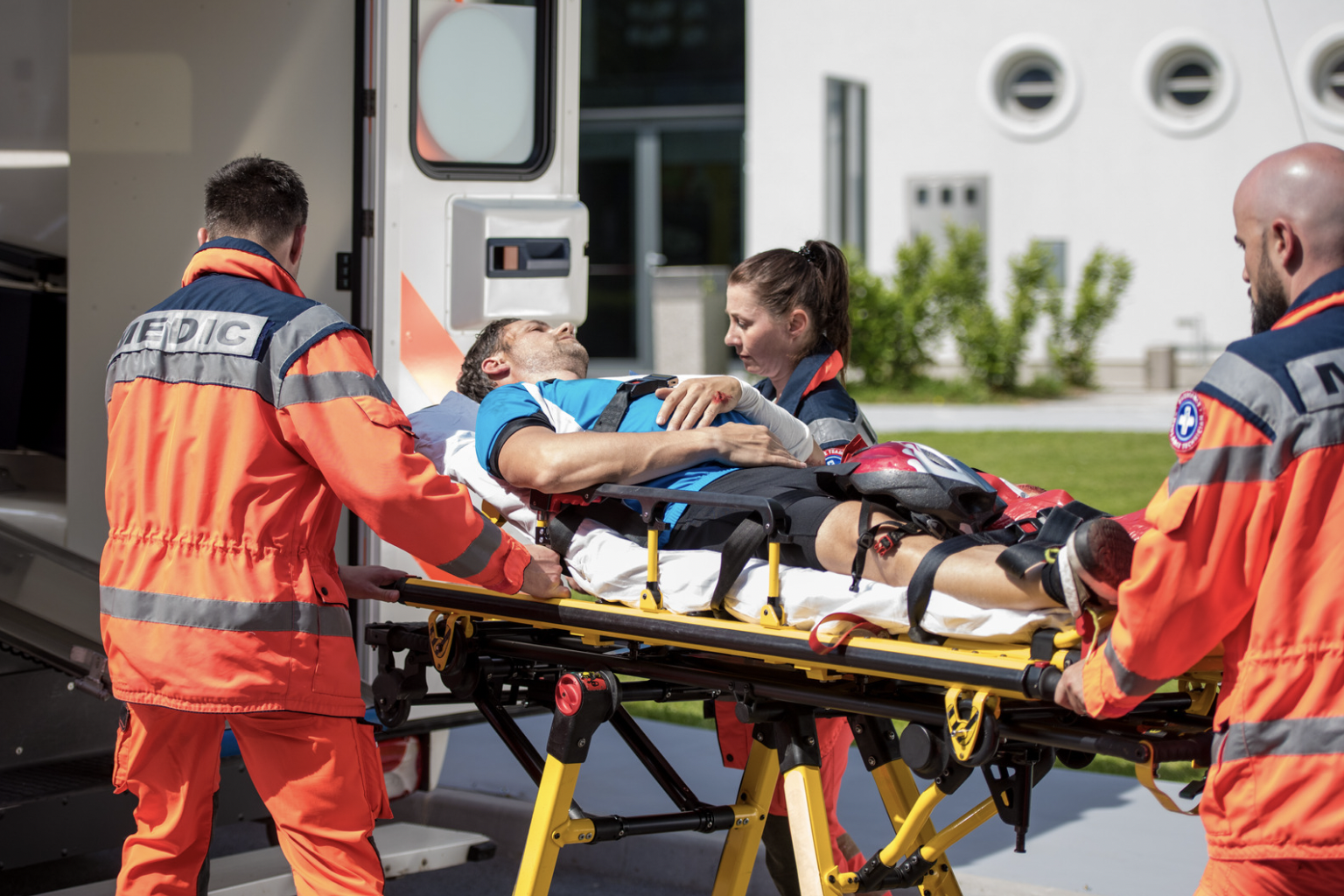 coronis health ems medical workers transporting patient on stretcher
