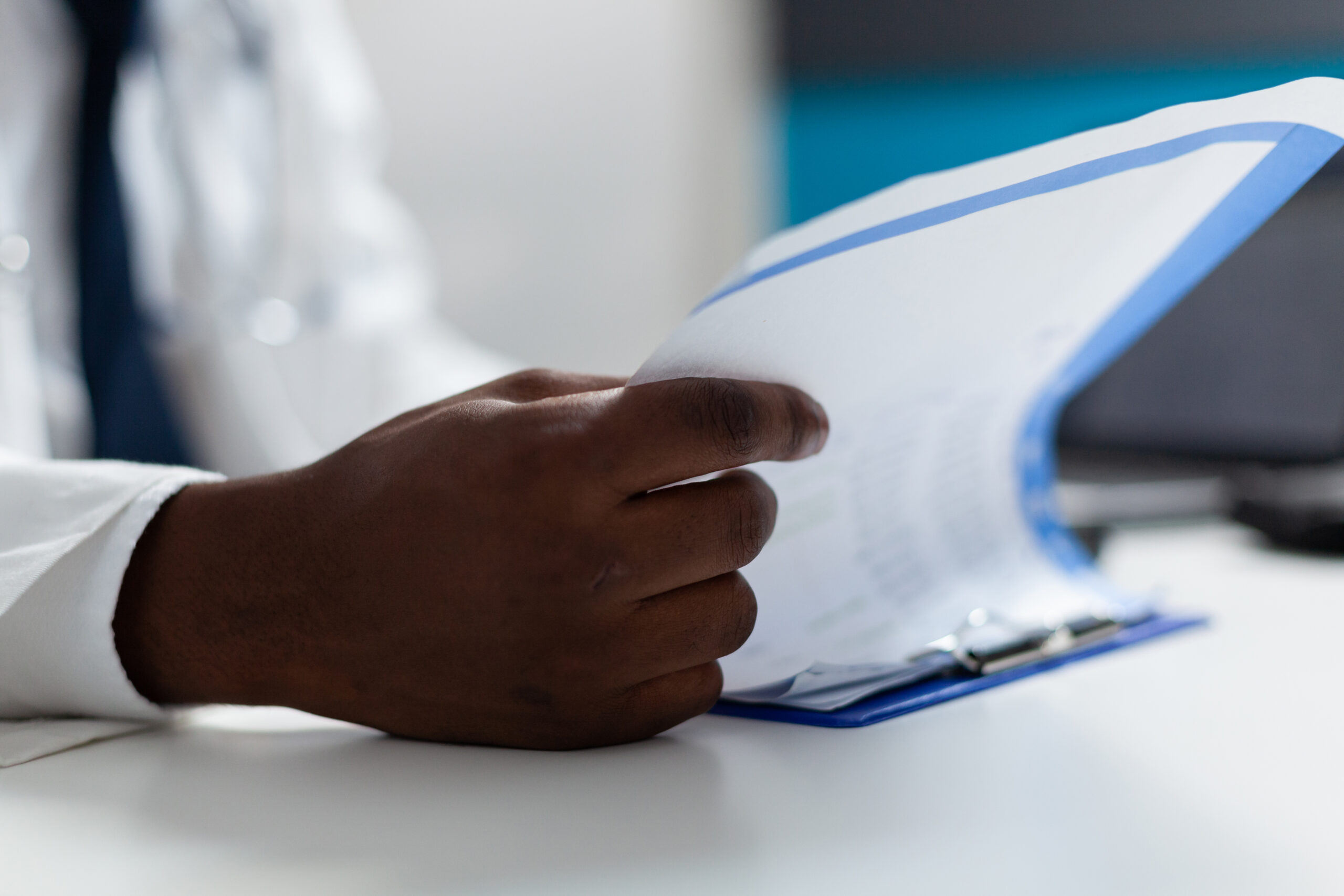 coronis health anesthesiologist medical biller examining documents