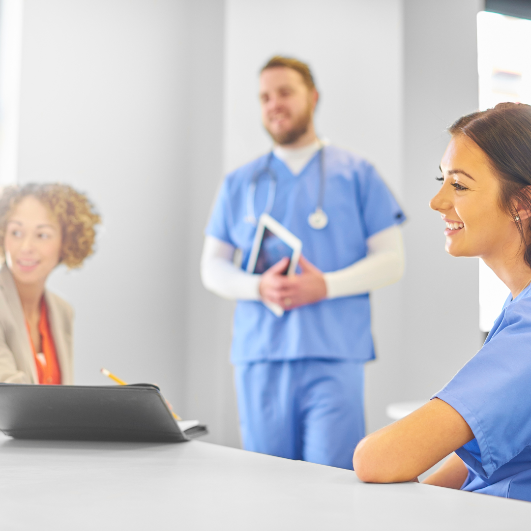 coronis health hospital workers having a meeting about medical billing