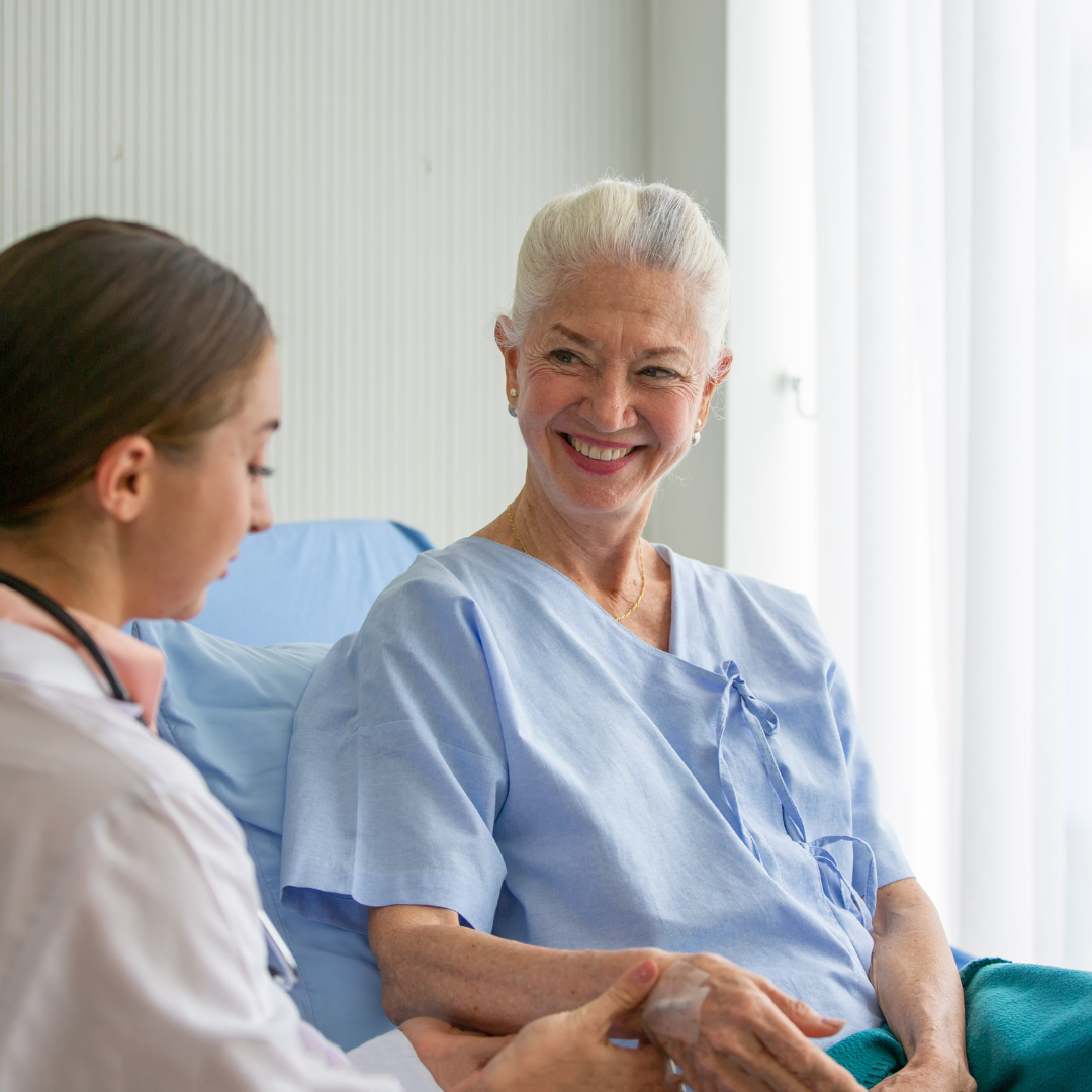 coronis health hospital healthcare worker taking elderly patient's pulse
