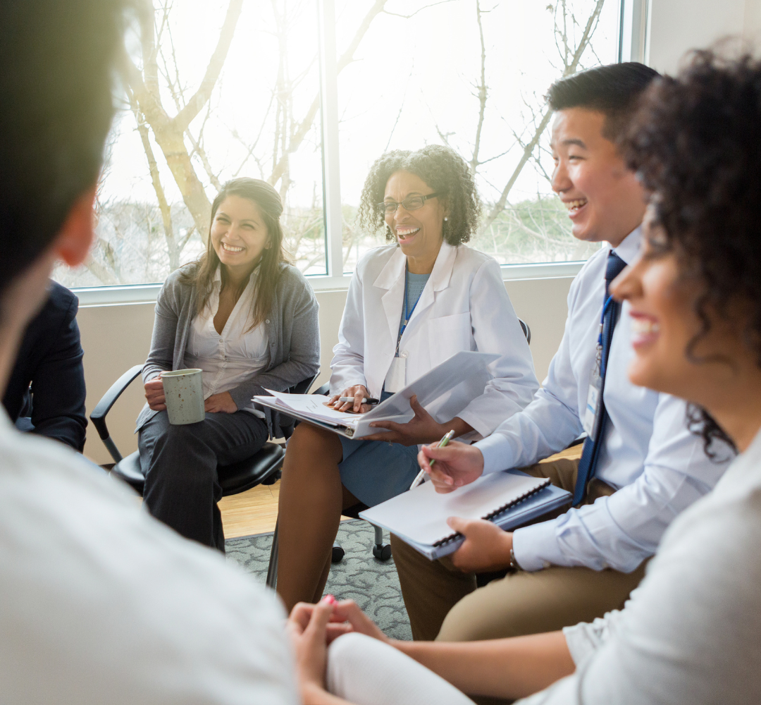 coronis health a group of RCM medical workers having a group discussion