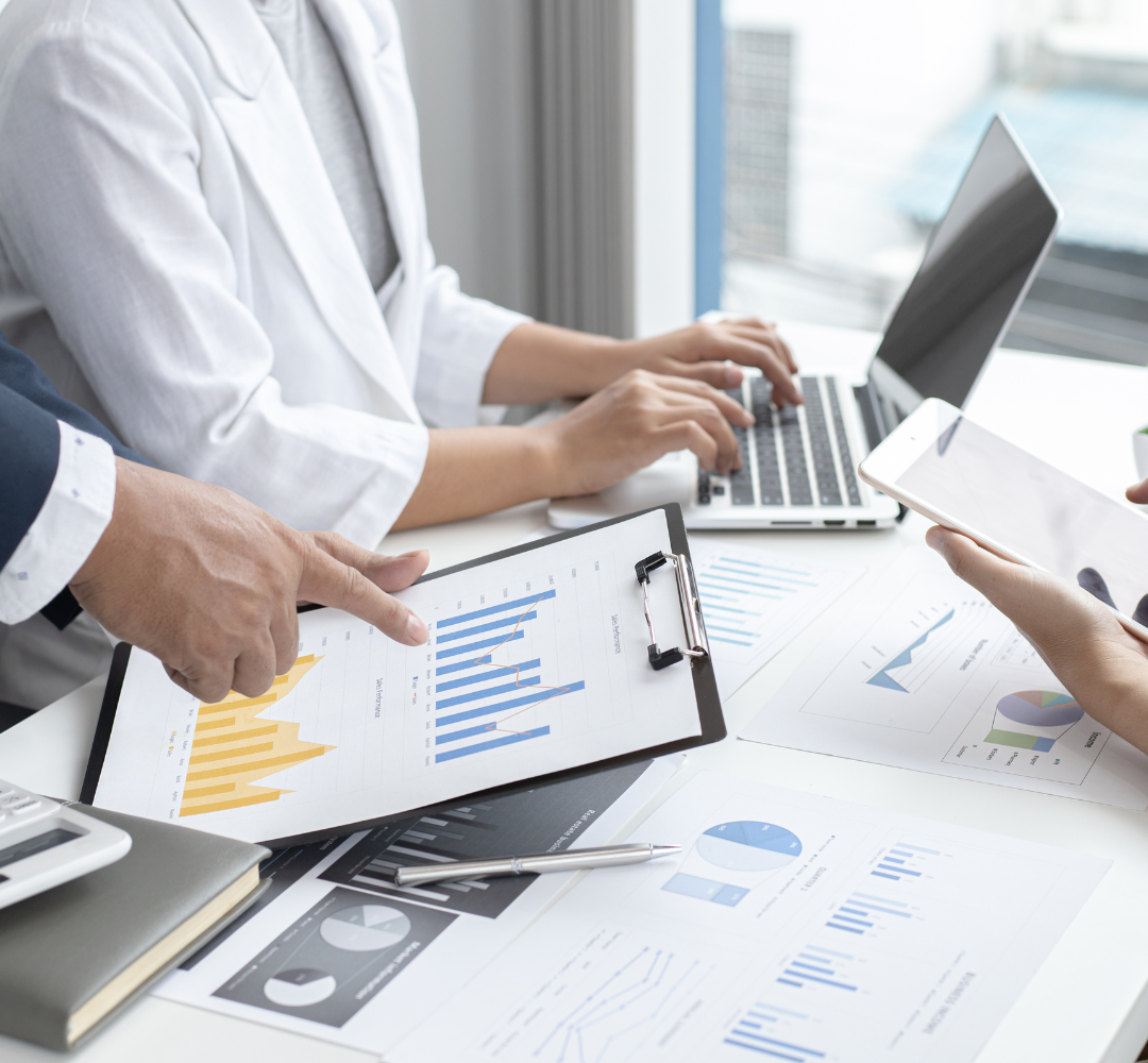 Coronis health RCM medical billers discussing financial graphs