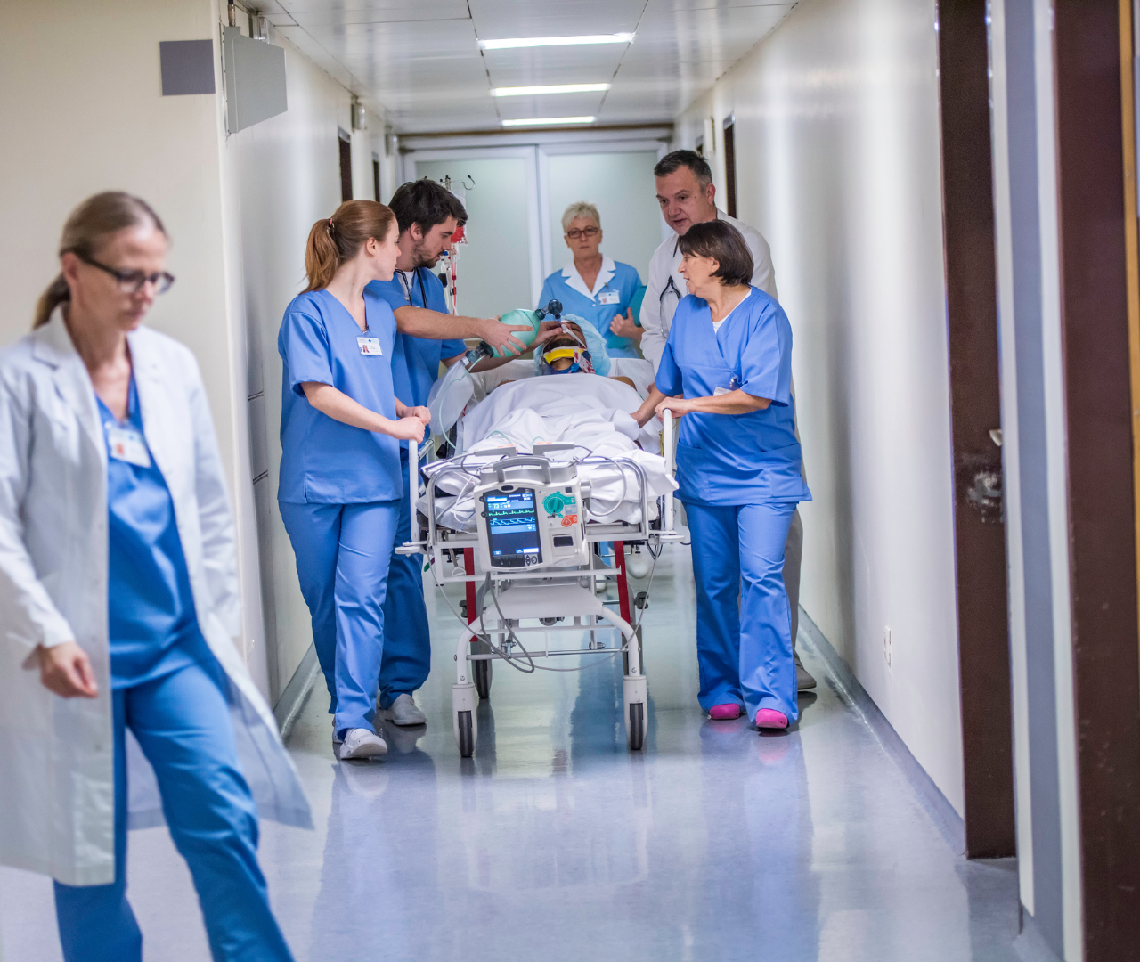 coronis health hospital medical workers rushing patient in stretcher to ER