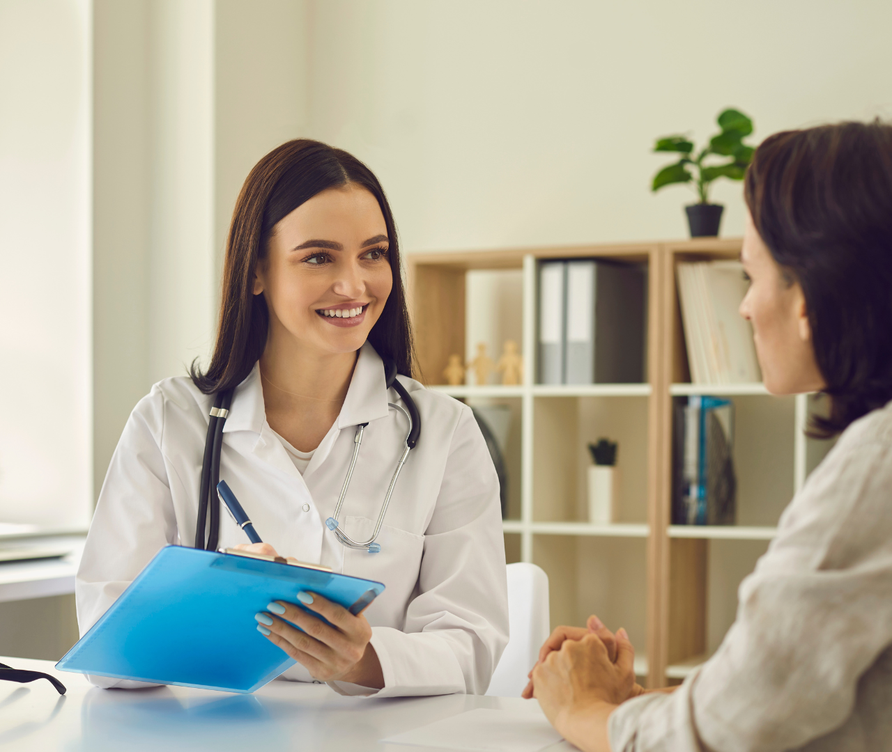 coronis health hospital medical biller talking with client