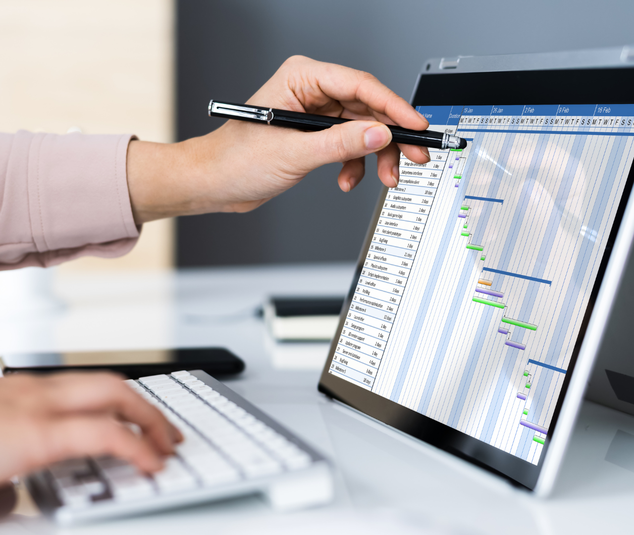 coronis health hospital medical biller working with graphs on tablet