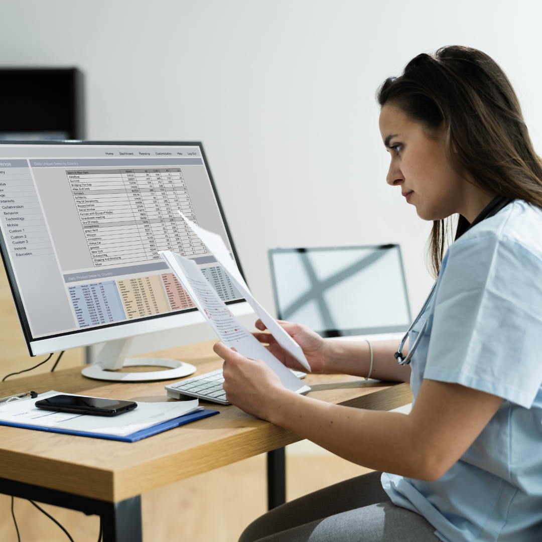 coronis health hospital worker looking through medical documents