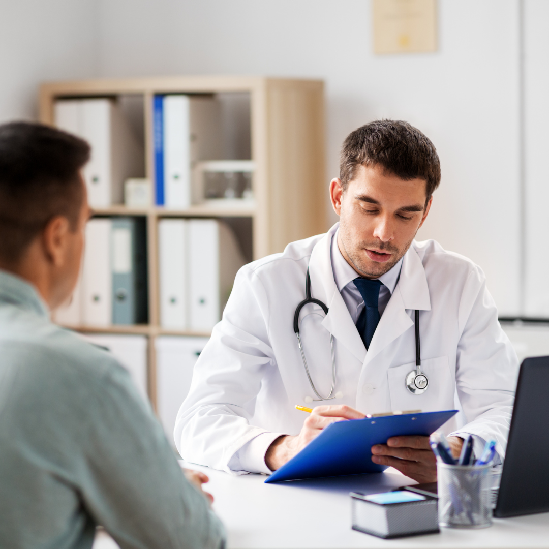 hospital medical professional going over document with patient
